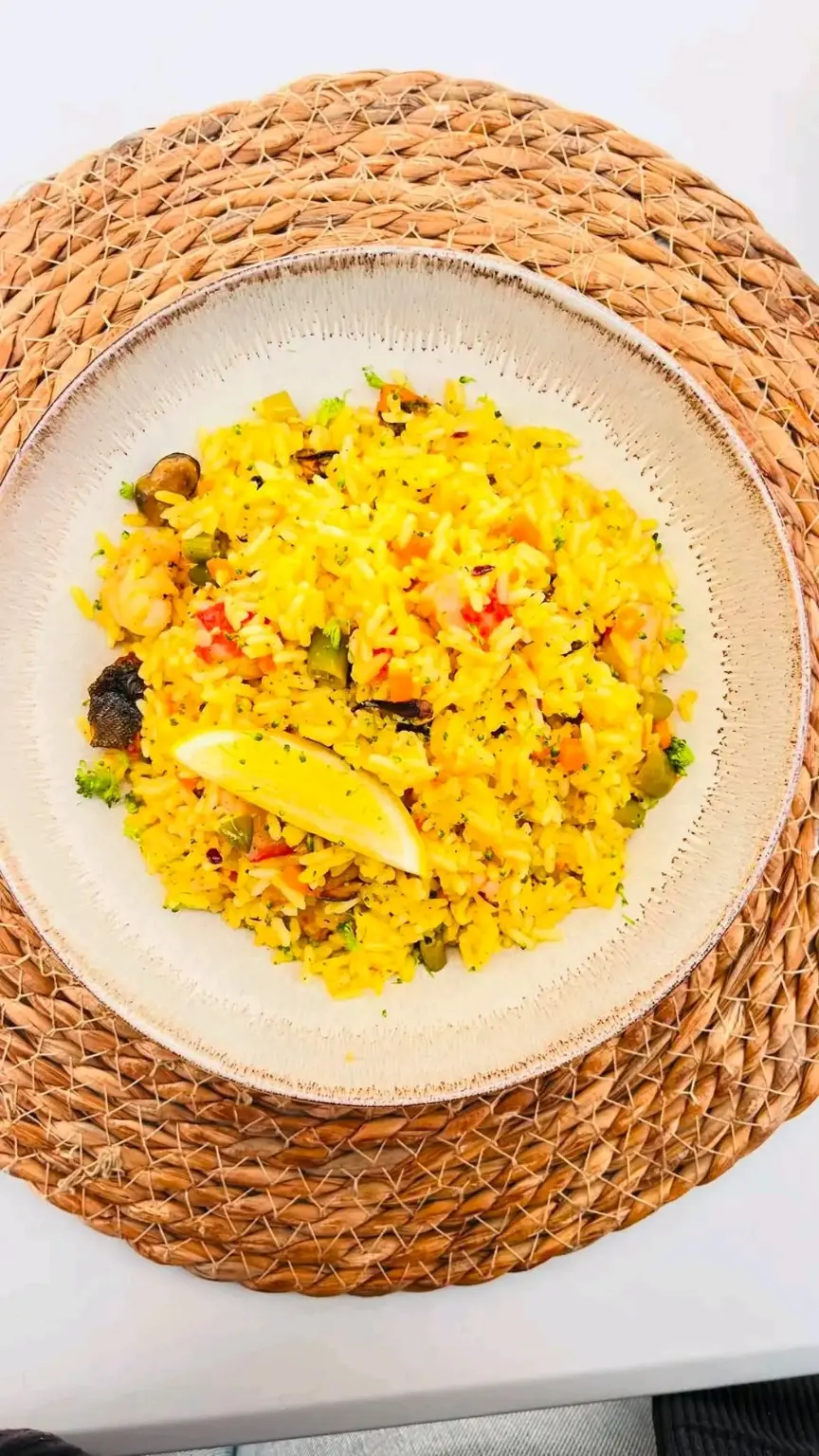 A beautifully plated yellow rice dish